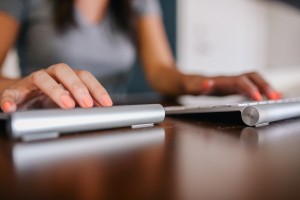 hands typing on keyboard