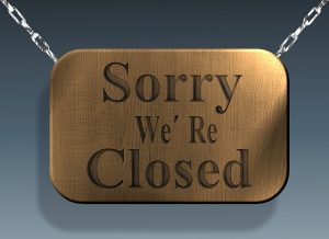 A board that says "Sorry we're closed."