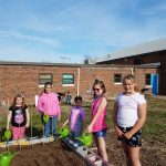 Picture of children watering garden