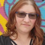 Picture of Stephanie rothman in front of mural